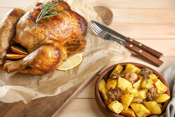 Delicious whole roasted chicken served on table