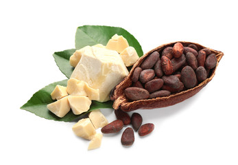 Half of ripe cocoa pod with beans and butter on white background