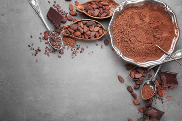 Composition with different cocoa products on grey background, top view