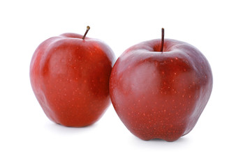 Two ripe red apples on white background