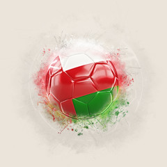 Grunge football with flag of oman