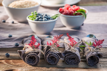 Tasty breakfast with berry fruits and milk in sunny day
