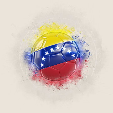 Grunge football with flag of venezuela