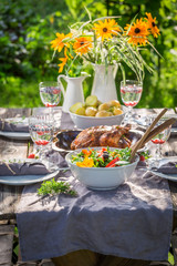 Tasty dinner with chicken and vegetables served in summer