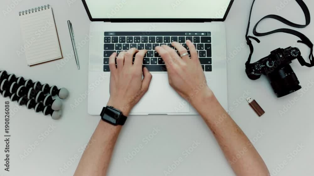 Aufkleber man is working typing use laptop computer. photographer flat lay top view workplace