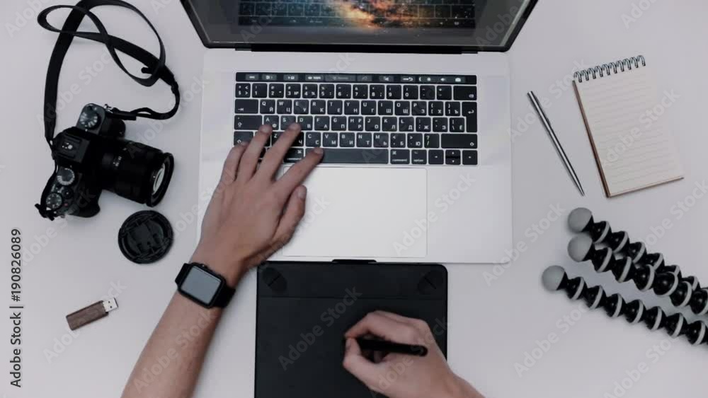 Aufkleber man is working laptop computer and graphic tablet. designer flat lay top view workplace