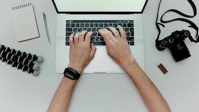 Man is working typing use laptop computer. Photographer flat lay top view workplace
