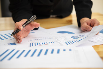 Business people using computer meeting to analyze and discuss the situation on the marketing data online in the meeting room.Business concept