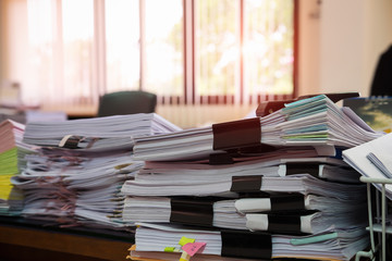 Close up paper stack on the desk related to business functions.Stack of business document...