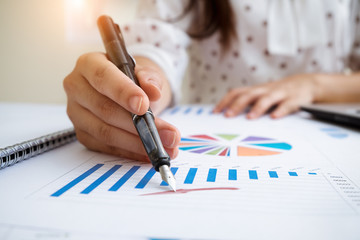 Asian business people using computer meeting to analyze and discuss the situation on the marketing data online in the meeting room.Business concept idea