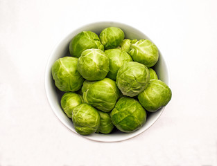 White Ceramic Bowl of Fresh Green Brussels Sprouts