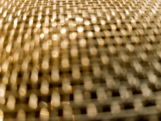 Gold mesh net with focus and shallow depto fo field, gold bokeh net pattern - 190832093