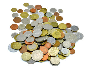 Silver and copper coins from around the world on isolated background
