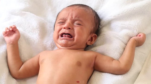 Newborn baby boy crying 