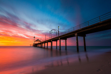 Fototapeta na wymiar A vibrant sunset at Brighton Jetty in Brighton, Adelaide, South Australia, Australia on 1st February 2018