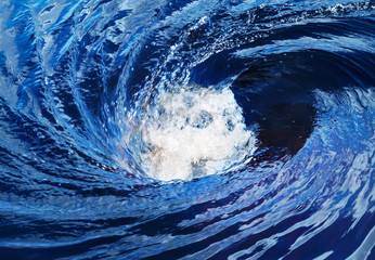 The raging whirlpool on surface of the deep river