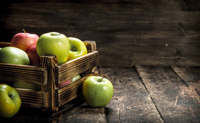 box with fresh red and green apples.