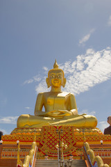 The big Buddha sitting on sky background  in Thailand.