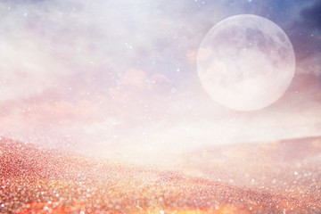 Surreal fantasy concept - full moon with stars glitter over planet.
