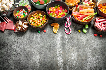 Multicolored candy, jelly and marshmallows in a bowl.