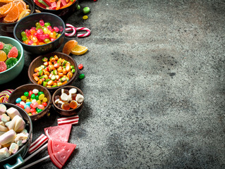 Multicolored candy, jelly and marshmallows in a bowl.