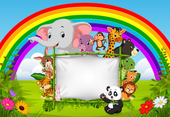 wild animal standing on a bamboo frame with rainbow scene