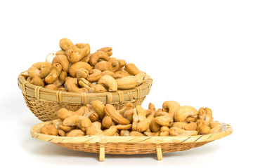 Cashew nuts in basket isolated on white background
