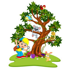 Many animals on the trees with boys holding magnifying glass
