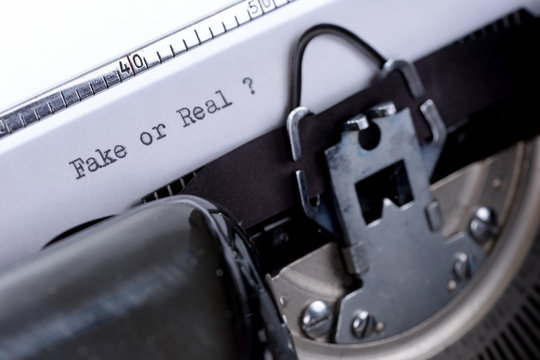 Text Fake or Real written on an old typewriter