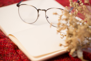 Naklejka na ściany i meble Closeup of book, glasses and autumn leaves, relax or other romantic concept