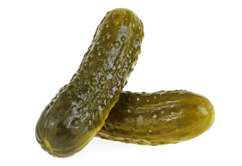 Two marinated pickled cucumbers isolated on white background