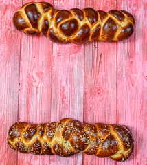 tasty challah on a wooden background