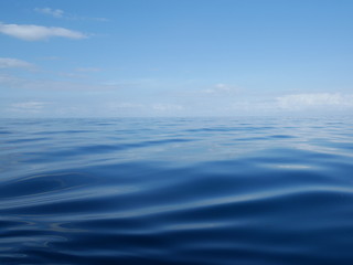 Blue ocean water, horizon line, water connects with the sky, blue sky, white clouds, calm water, calm ocean, Pacific Ocean, Indian ocean, beautiful scenery, the depth of the sea