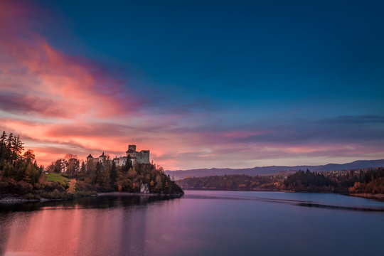 Stunning dusk over castle by the lake, Poland