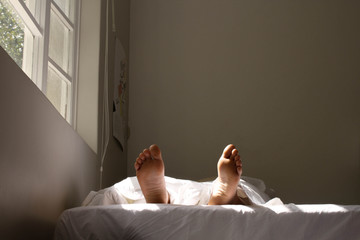 the feet of a person who is sleeping