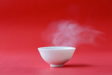 A white bowl has a hot air
