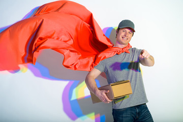 Hey you. Portrait of outgoing man expressing heroism and holding parcel. He pointing finger in...
