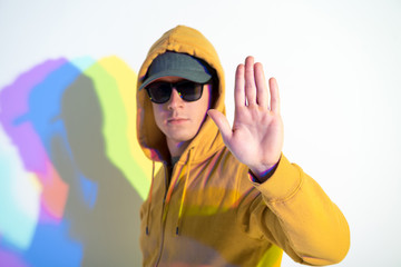 Stop. Portrait of calm male gesticulating his hand. Control concept