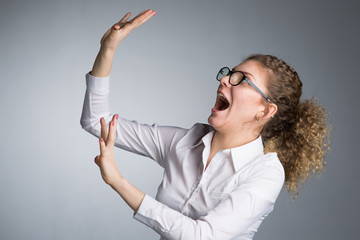 Young business woman on gray background