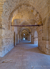 Naklejka premium Passage at the Citadel of Qaitbay, an old historical castle in Alexandria, Egypt, a fifteen century defensive fortress located on the Mediterranean sea coast