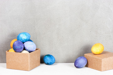 Textured background decorated with colored easter eggs