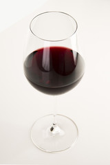 Glass of red wine isolated on white