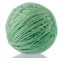 Yarn for handwork and knitting. Set on a white background with reflection.