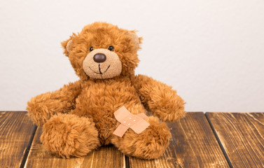 teddy bear with sticking plaster