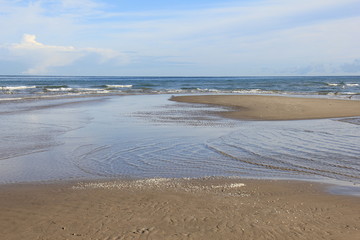 Beach near lighthouse, Skagen Grå Fyr, Denmark. North Sea Coast.
