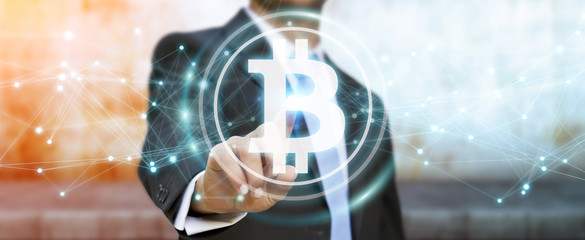 Obraz na płótnie Canvas Businessman using bitcoins cryptocurrency 3D rendering
