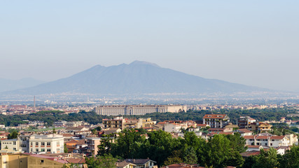 Fototapeta na wymiar Royal Palace of Caserta and Vesuvius in the background