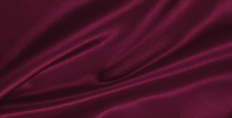 Smooth elegant pink silk or satin luxury cloth texture as abstract background. Luxurious valentines day background design