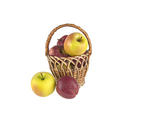 wet, clean apples in a basket on a white background