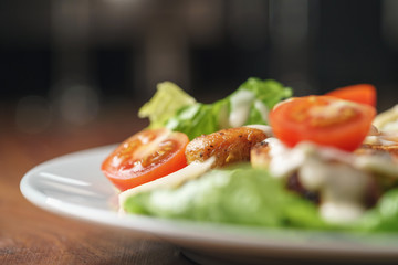 caesar salad with cherry tomatoes closeup